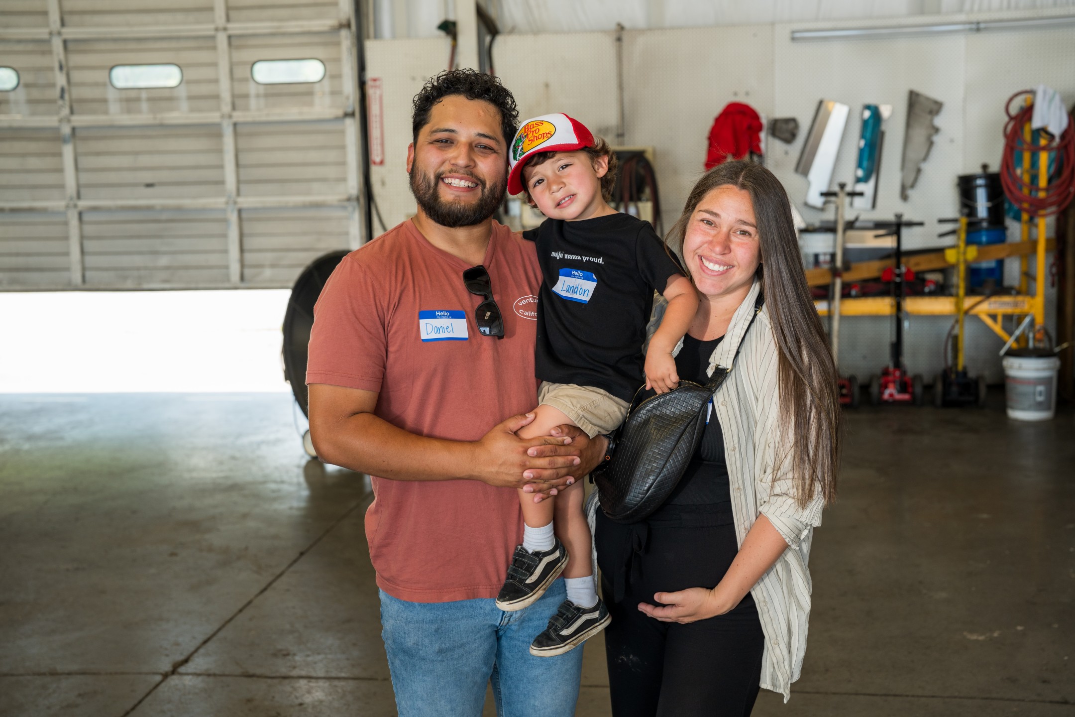 Family smiling in Truck Repair shop
